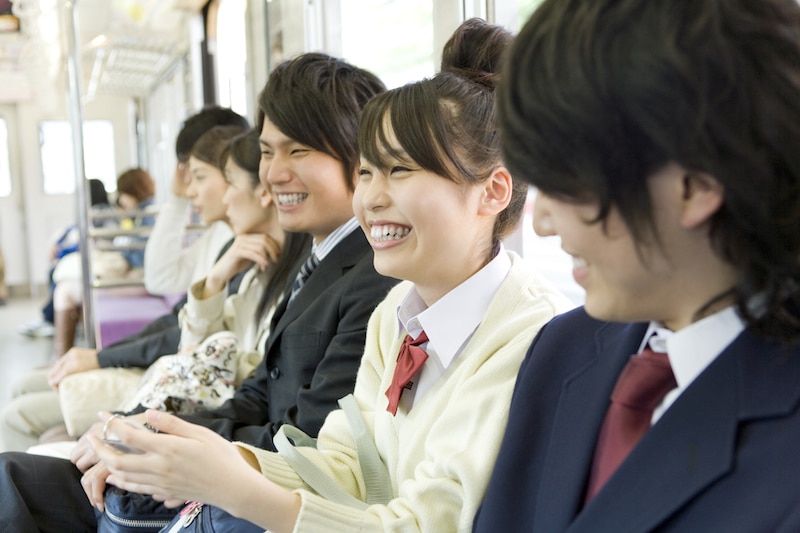 go-home-students-high-school-train-smilimg-sitting